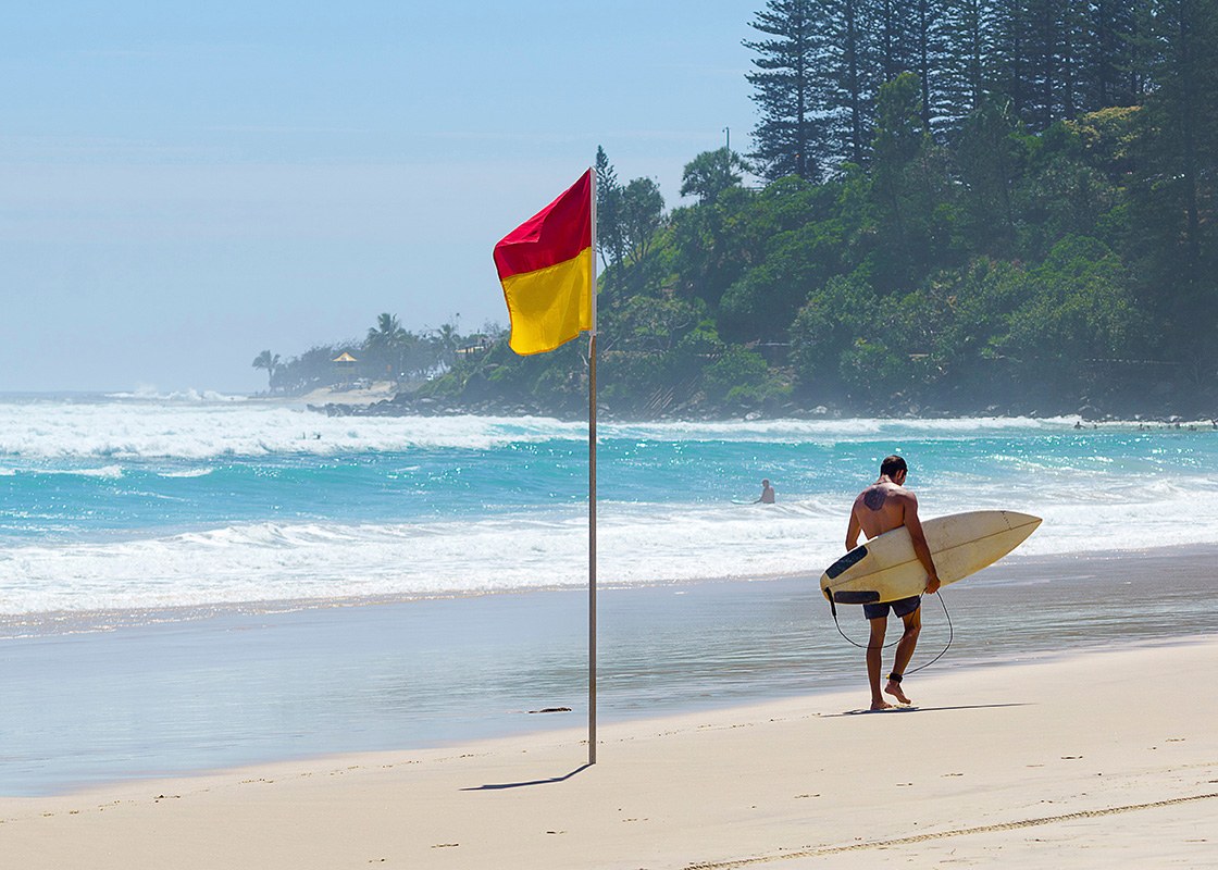 Surfer on a patrolled beach